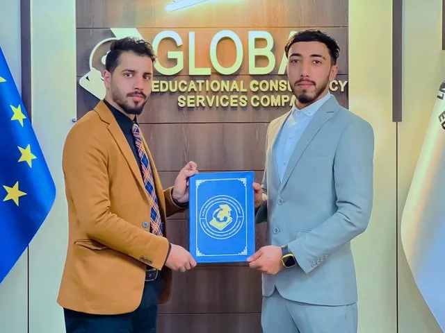 A GECSC staff member receiving a certificate of appreciation