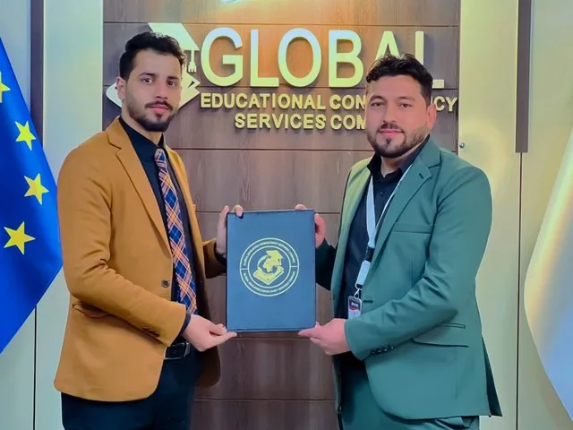 A GECSC staff member receiving a certificate of appreciation