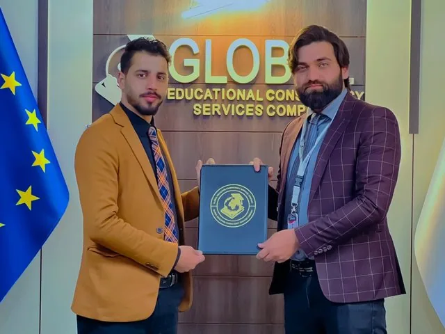A GECSC staff member receiving a certificate of appreciation