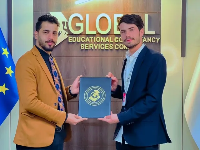 A GECSC staff member receiving a certificate of appreciation