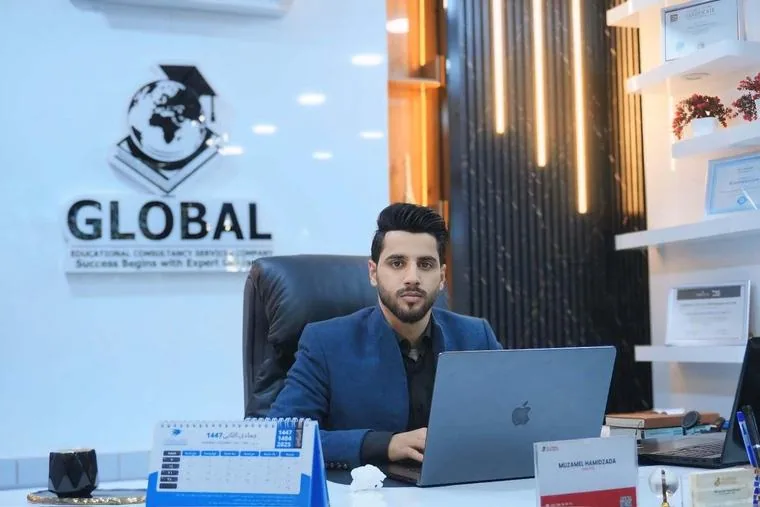 Muzamel Hamidzada, Director of GECSC, at his desk in the Kabul office