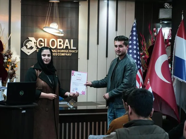 A participant receiving a certificate of participation